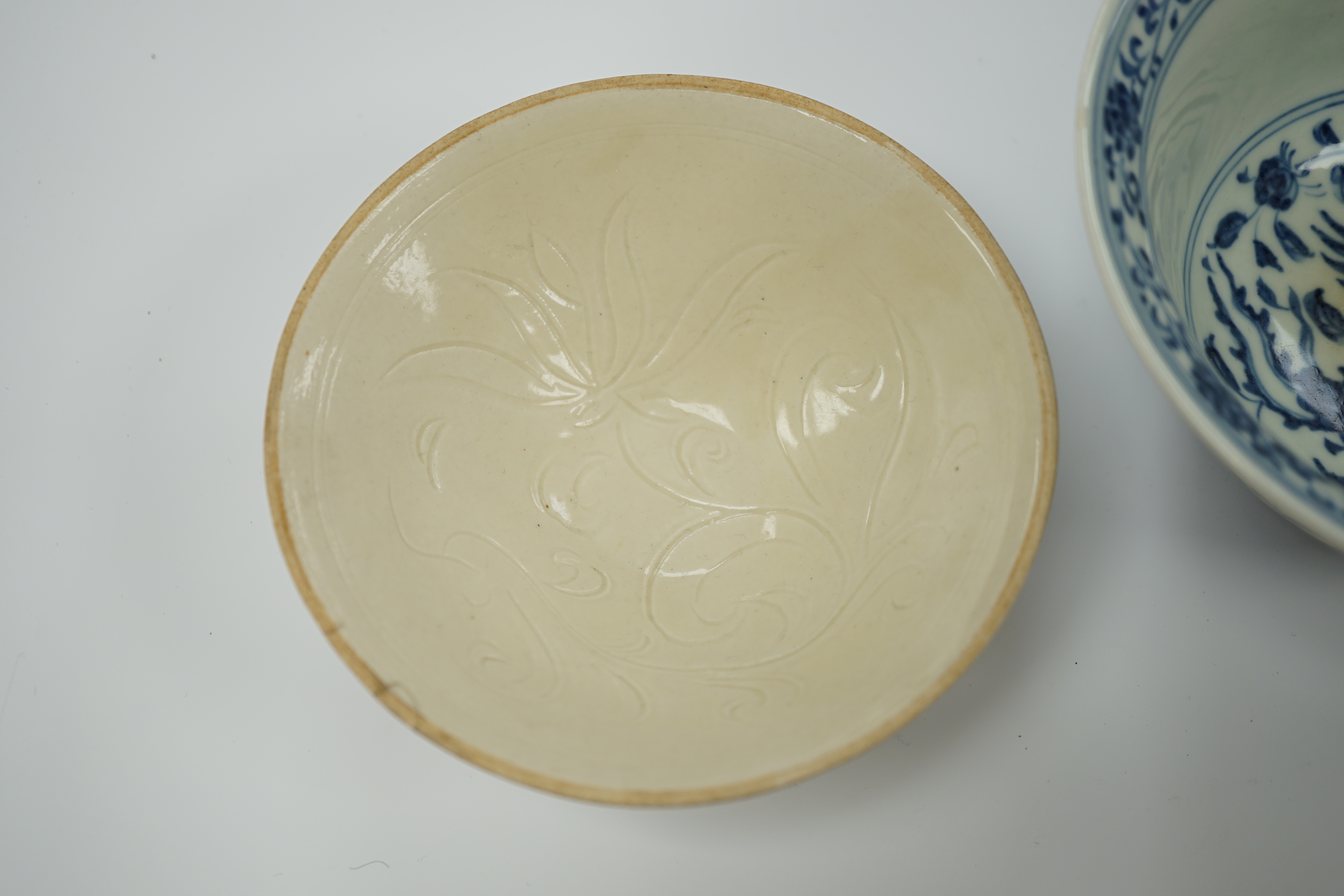 A Chinese blue and white porcelain bowl, Xuande mark but later and another bowl